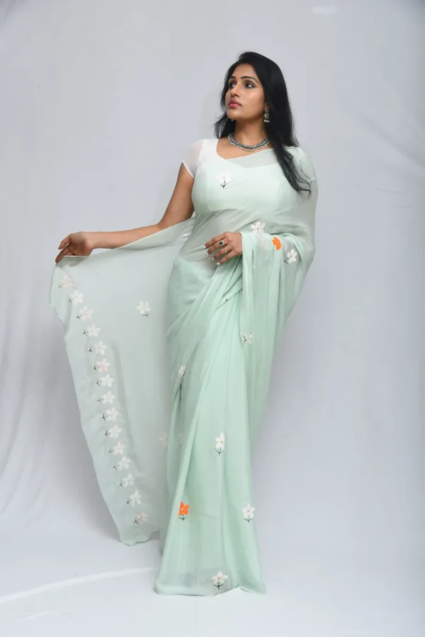 Mint Green Floral Saree with Subtle Orange Accents