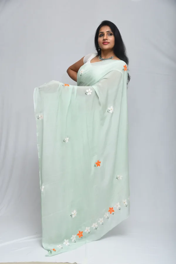 Mint Green Floral Saree with Subtle Orange Accents