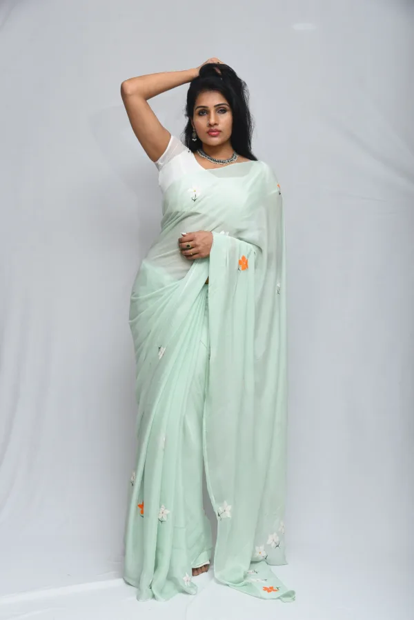 Mint Green Floral Saree with Subtle Orange Accents