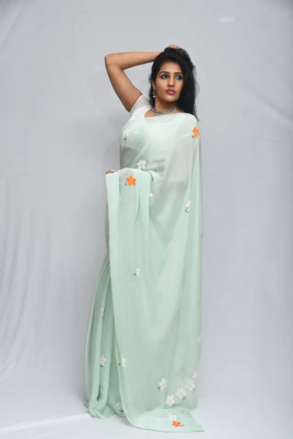 Mint Green Floral Saree with Subtle Orange Accents