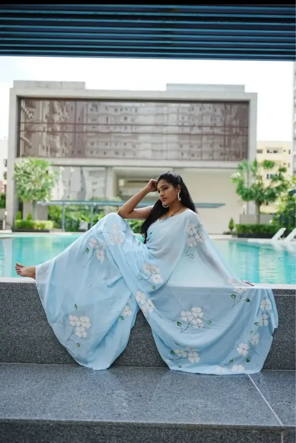 pure georgette hand painted powder blue saree with lily bunches