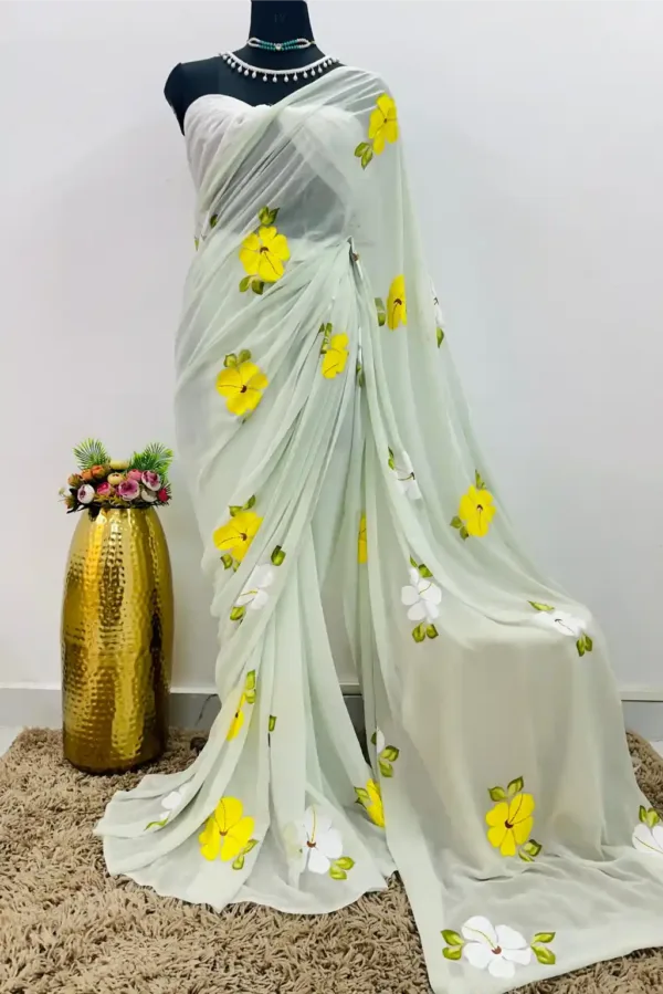 pure georgette hand painted ice blue saree with white and yellow hibiscus flowers